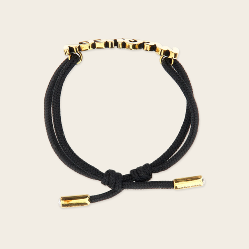 Alexander McQueen Graffiti Bracelet Alexander McQueen Graffiti Logo Bracelet with gold plaque logo in gold, two crystals inside both ends of the bracelet gives the luxury touch.