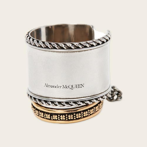 Alexander McQueen Chained Rings Alexander McQueen Chained double ring with logo engraved Silver and aged yellow. Composition Brass
