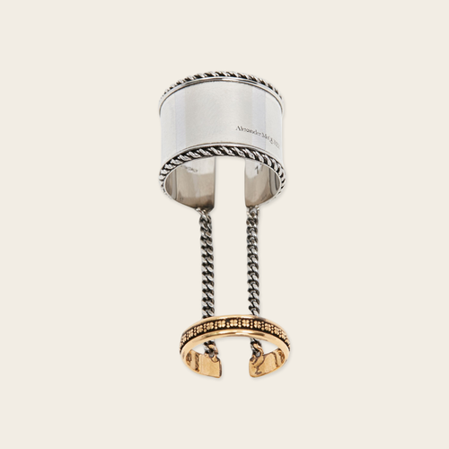 Alexander McQueen Chained Rings Alexander McQueen Chained double ring with logo engraved Silver and aged yellow. Composition Brass